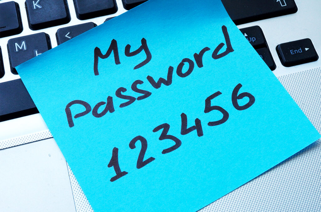 wifi password recovery without jailbreak ios Person writing down Wi-Fi password in notebook with smartphone nearby